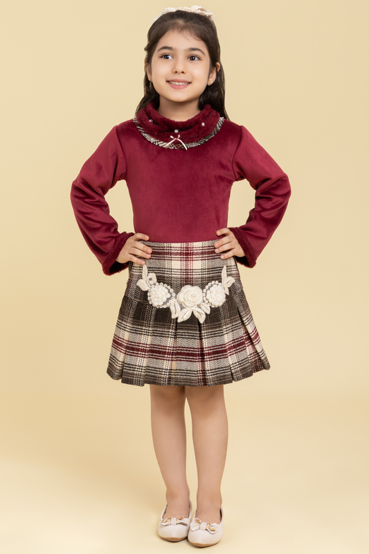 Maroon top and checkered skirt with fancy patch