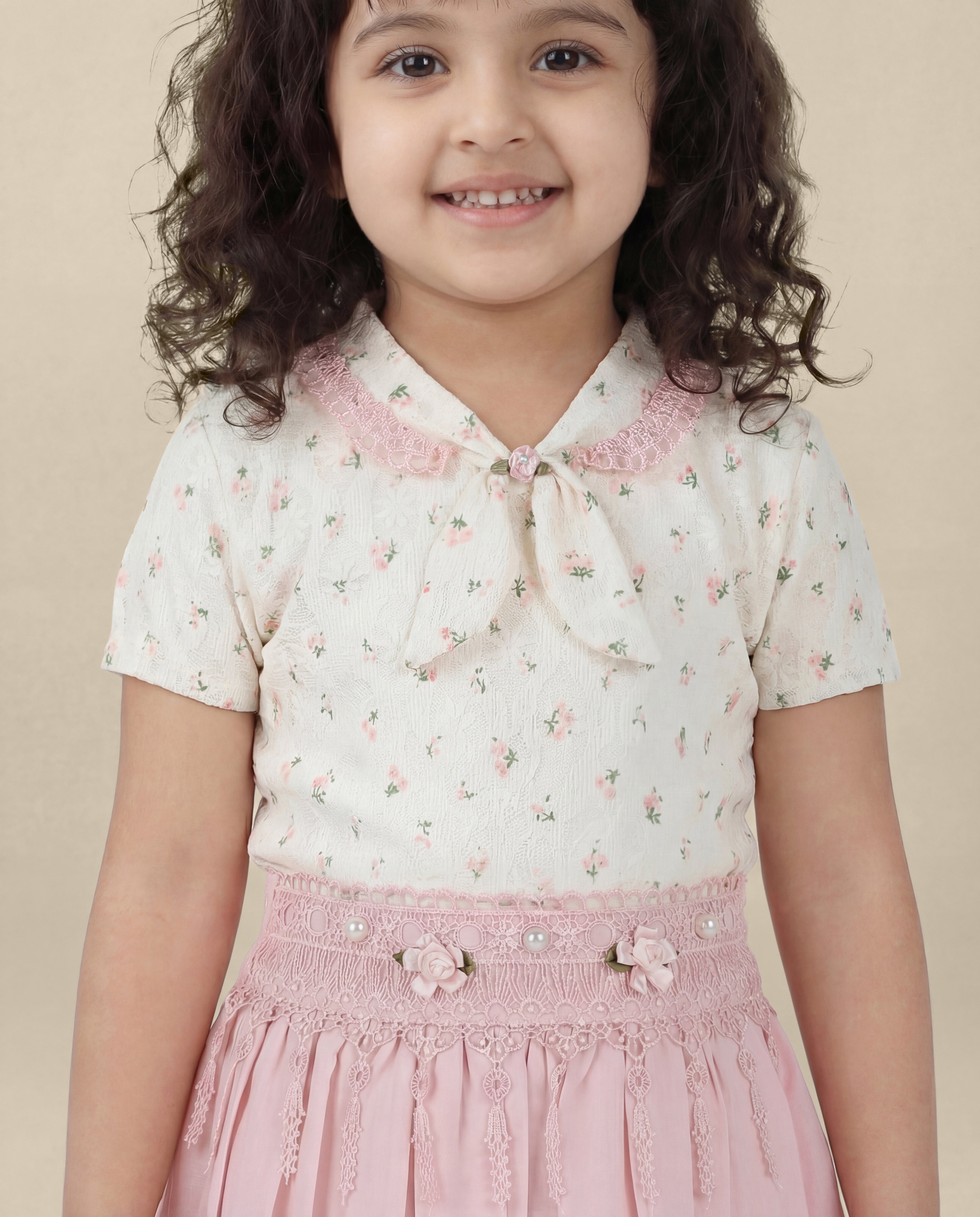 Floral print top with light pink skirt