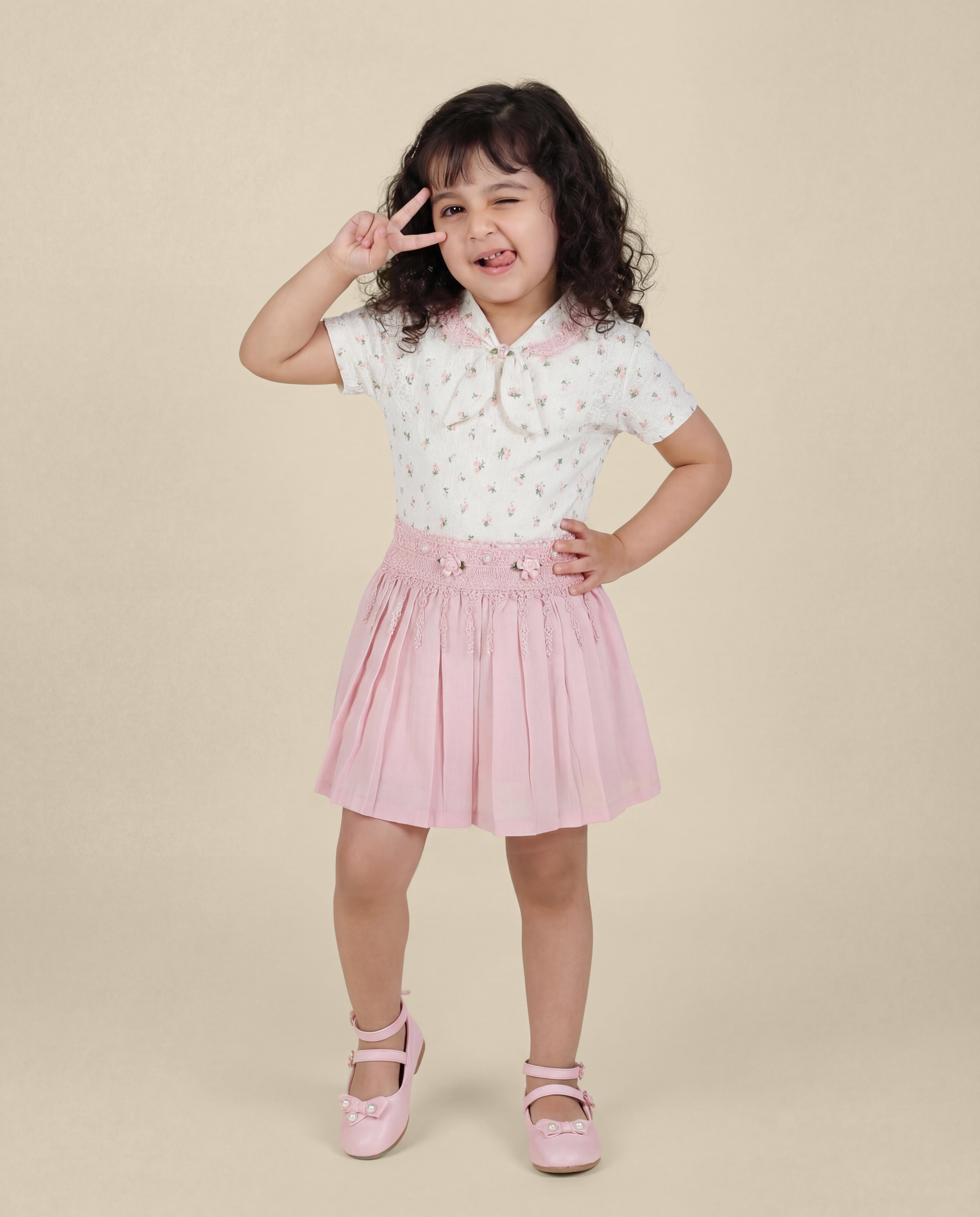 Floral print top with light pink skirt
