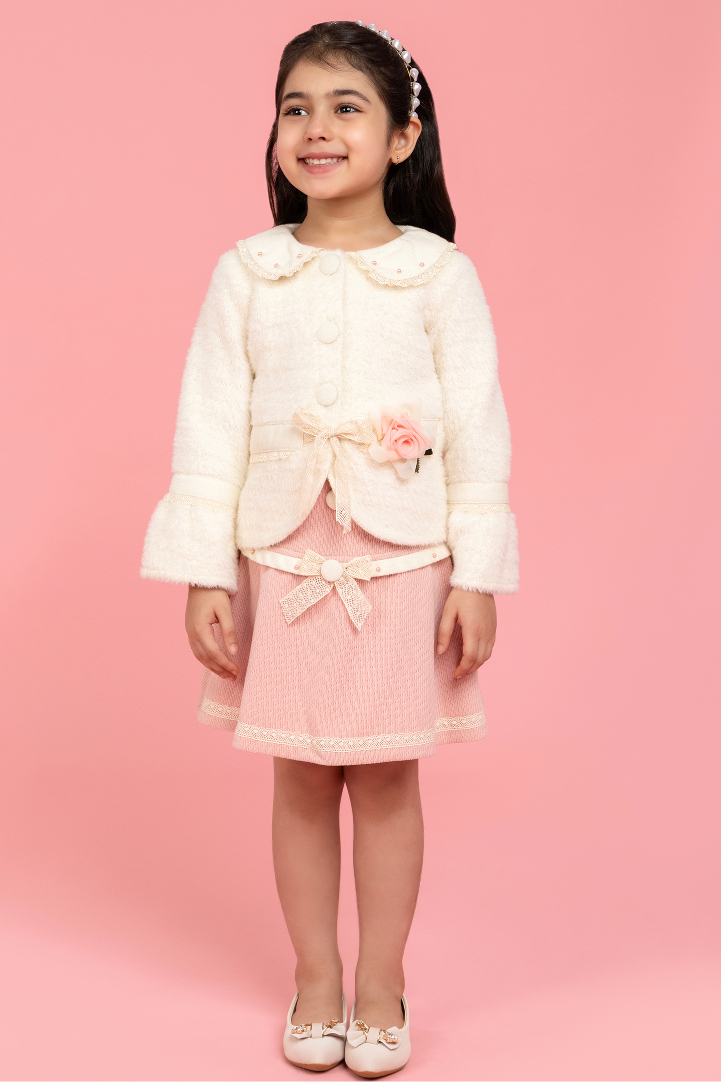 Formal buttoned top with baby pink skirt