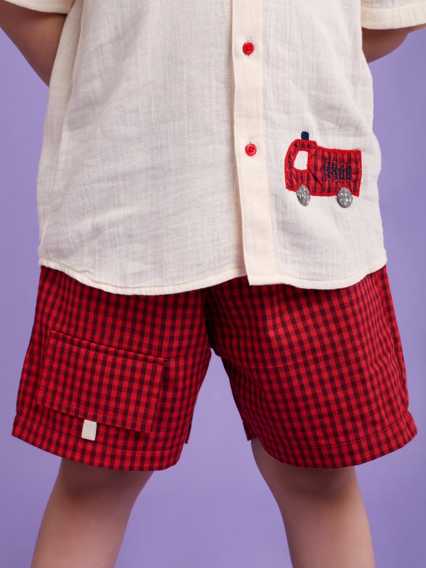 Cream shirt with car embroidery and rust check shorts