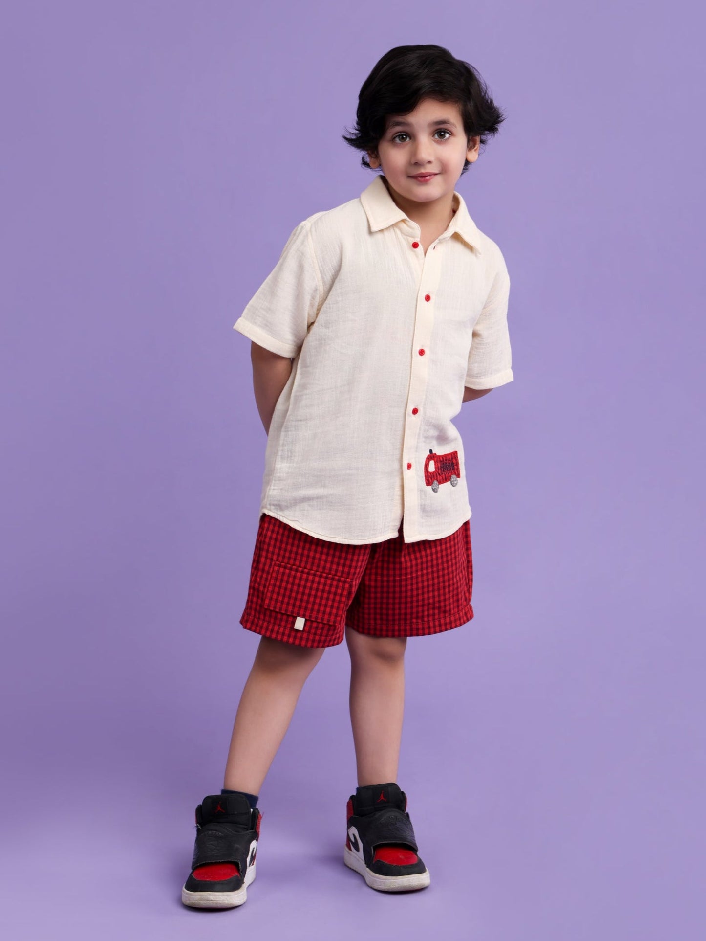 Cream shirt with car embroidery and rust check shorts