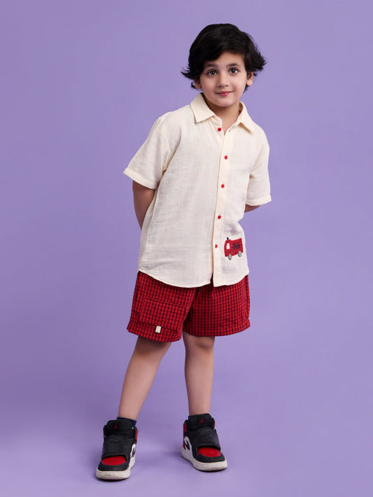 Cream shirt with car embroidery and rust check shorts