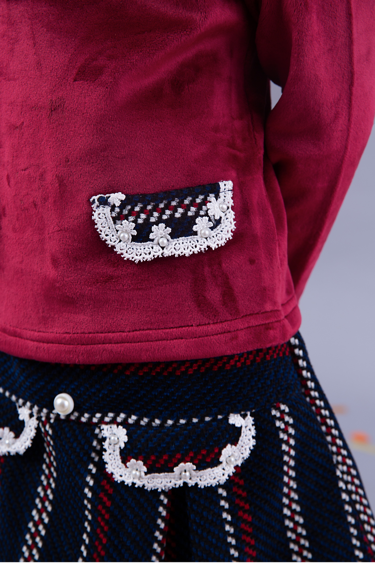 Maroon top with maroon and navy skirt