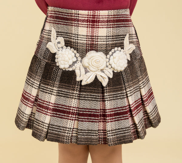 Maroon top and checkered skirt with fancy patch