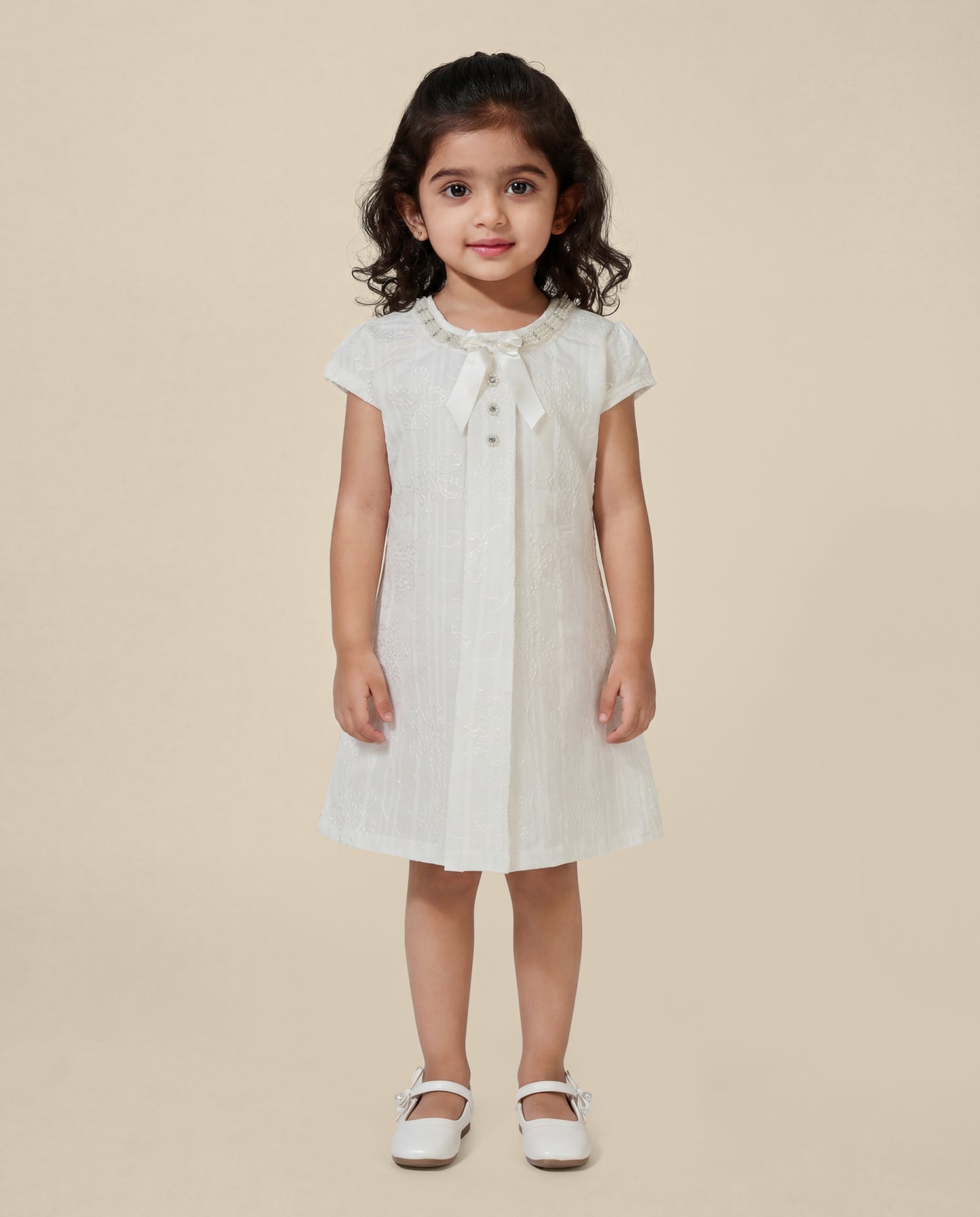 Embroidered dress with pearl detailing