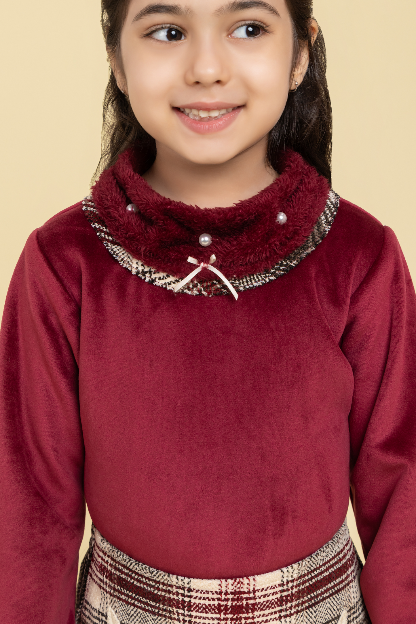 Maroon top and checkered skirt with fancy patch