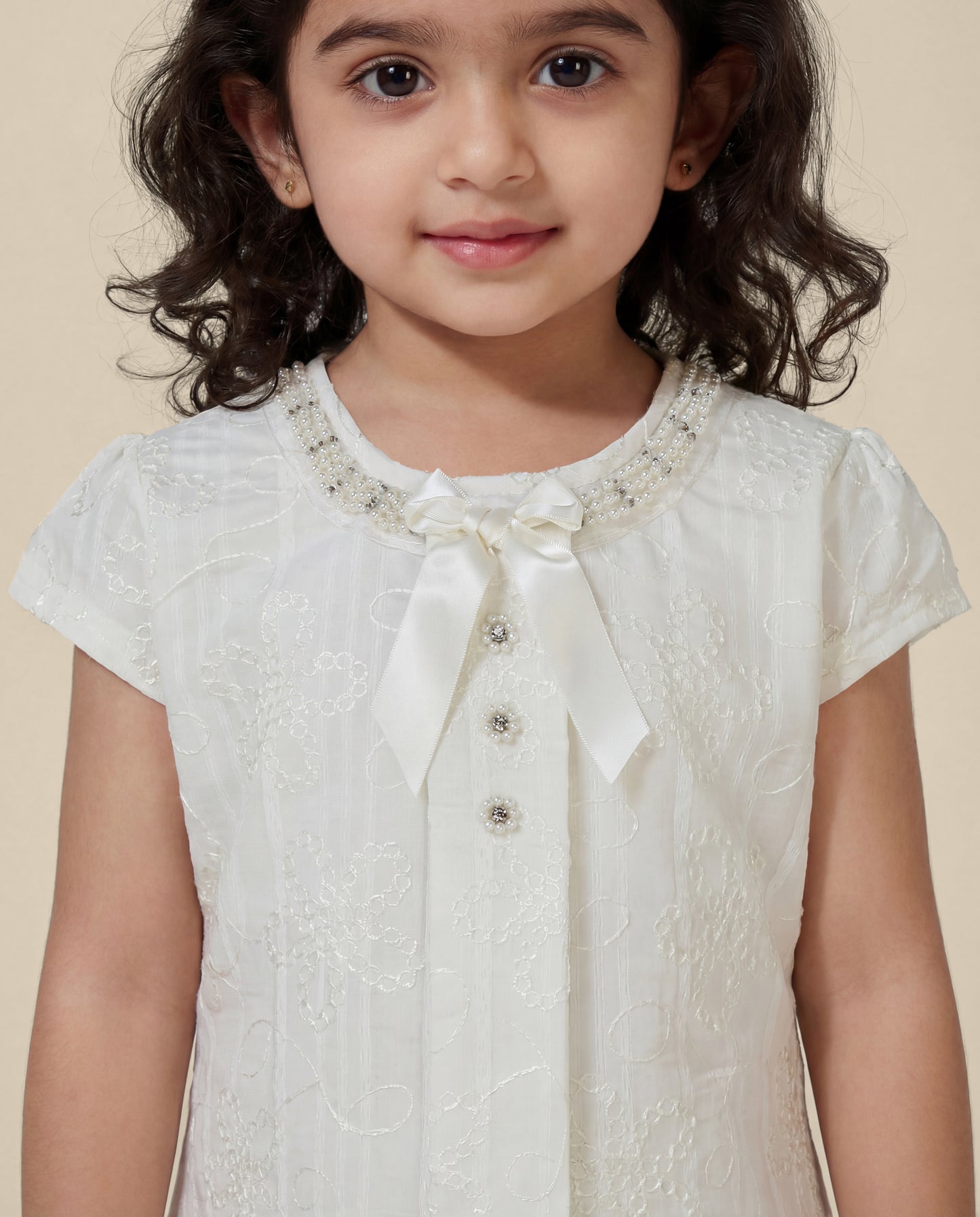 Embroidered dress with pearl detailing