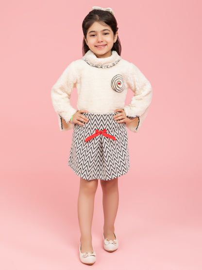 Soft cream top with black and white zig zag skirt
