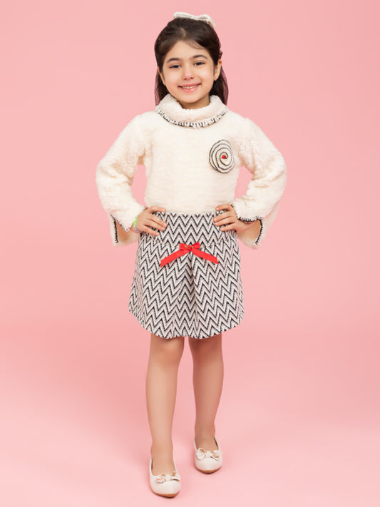 Soft cream top with black and white zig zag skirt