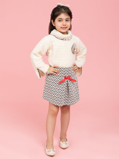 Soft cream top with black and white zig zag skirt