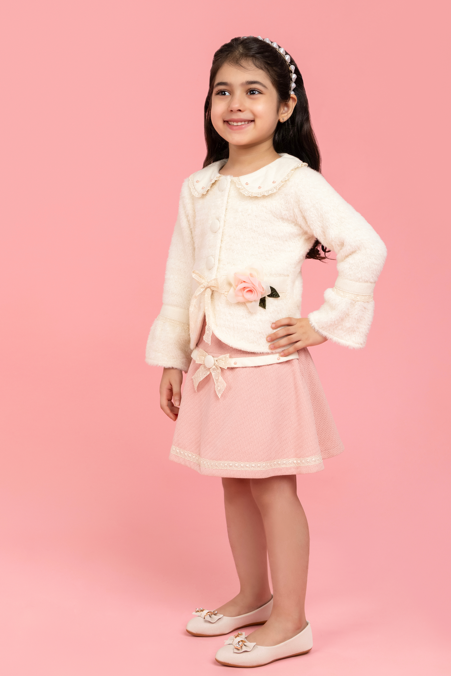 Formal buttoned top with baby pink skirt