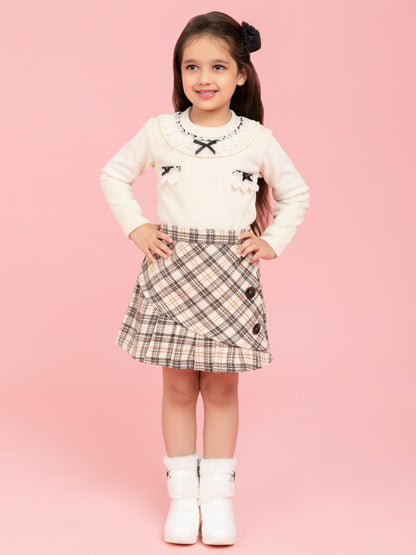 Cream top with fancy collar and checkered skirt