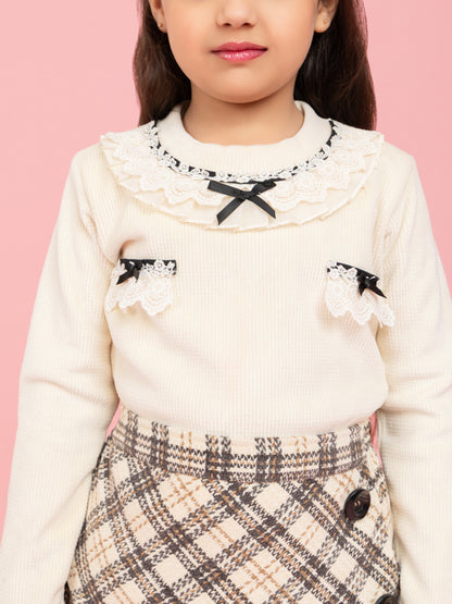 Cream top with fancy collar and checkered skirt