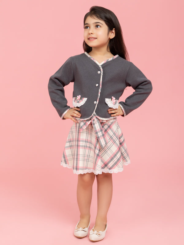 Grey buttoned top with checkered skirt
