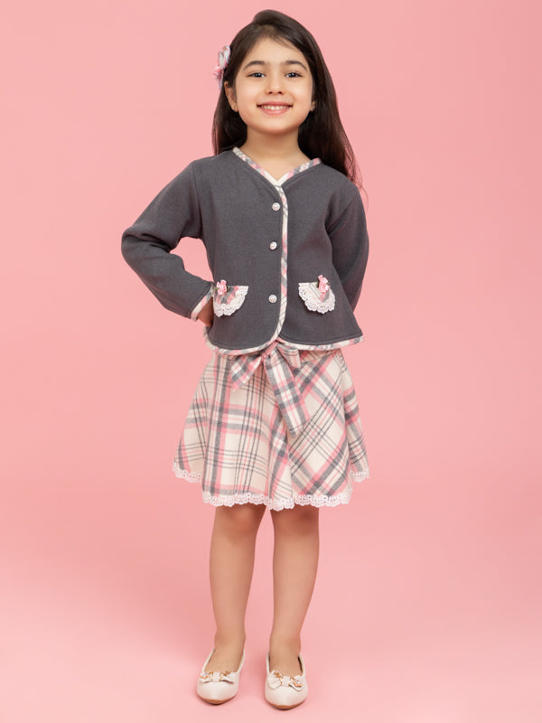 Grey buttoned top with checkered skirt