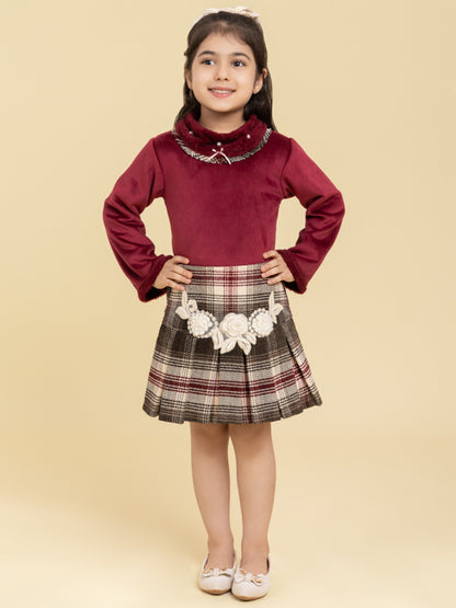 Maroon top and checkered skirt with fancy patch
