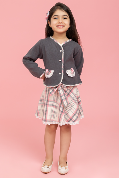 Grey buttoned top with checkered skirt