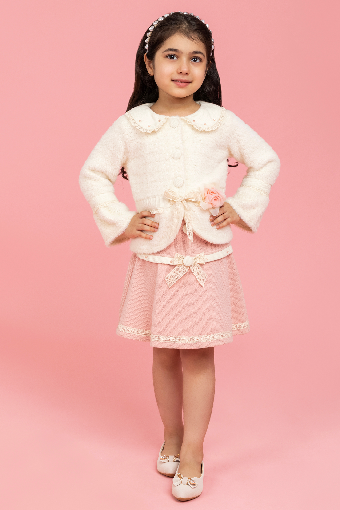 Formal buttoned top with baby pink skirt