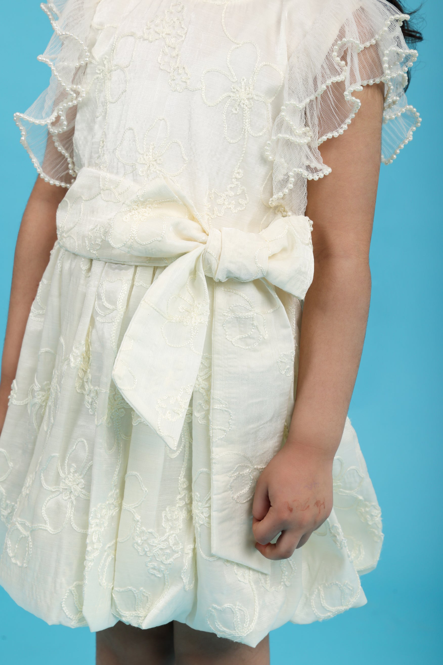 Fancy cream embroidered dress with tie up bow